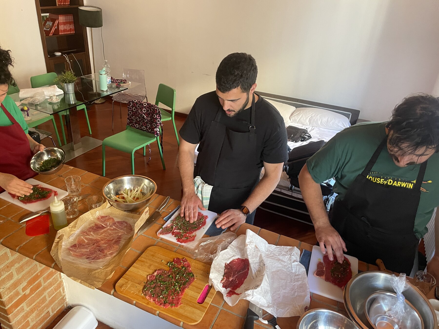 Chef Daniele preparing Saltimbocca alla Romana with guests